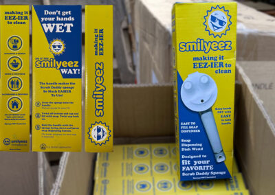 Yellow and Blue Smilyeez packaging for Dish Wand
